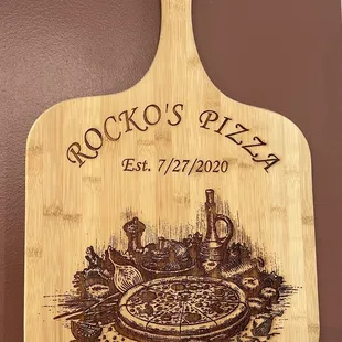 a pizza on a cutting board