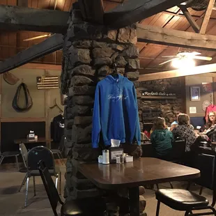people sitting at tables in a restaurant