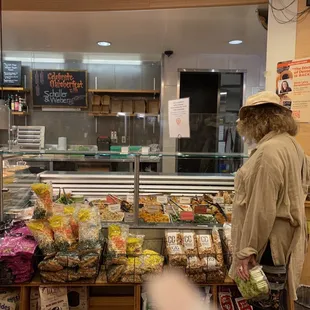 a man and a woman standing in front of a counter