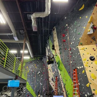 Staff resetting the Southwest climbing wall on a Monday.