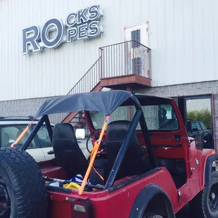 Entrance, with a cool red Jeep.