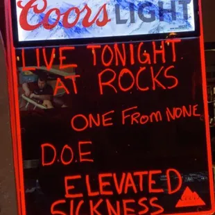 a neon sign for a rock bar