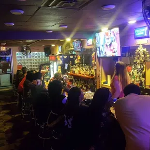 people sitting at the bar
