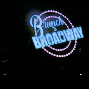 The TV screen gives the name.