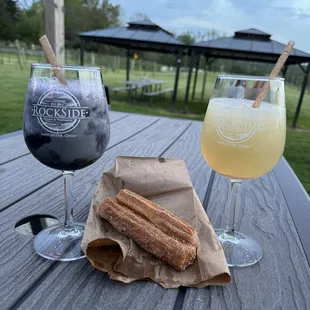 Wine slushes, churros (from food truck), and outdoor seating. You can see the vineyard all around.
