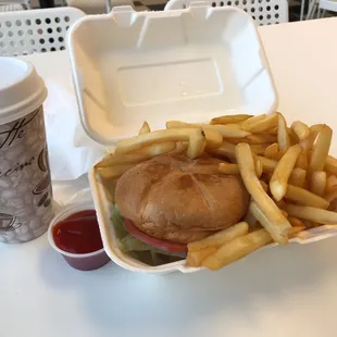 Salmon patty sandwich with fries.