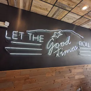 a neon sign that says let the good times roll