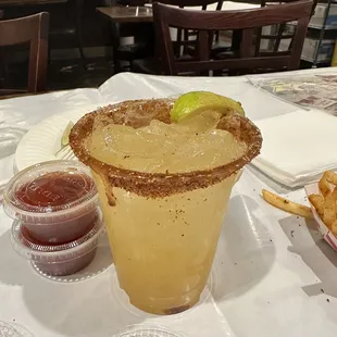 Delicious passion fruit margarita with tajin rim