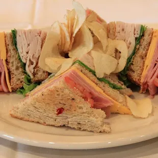 a club sandwich with potato chips