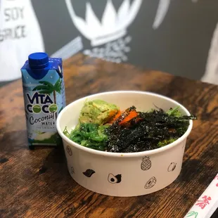 a bowl of food and a drink