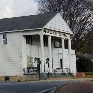 the front of a white building