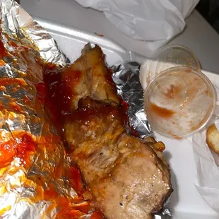 a plate of meat and a sandwich