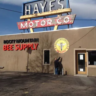 a man standing in front of a building