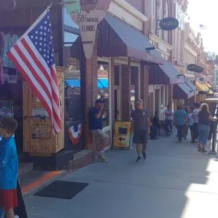 people walking down the sidewalk