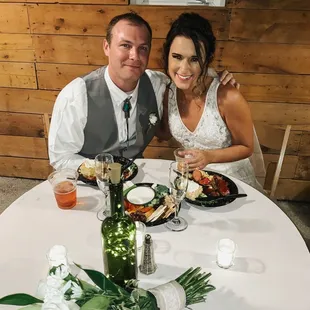 The newlyweds, enjoying their delicious wedding spread!