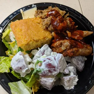 Pulled pork, BBQ chicken, potato salad, crisp salad, and cornbread. So good!!!
