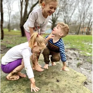 Children looking at worms.