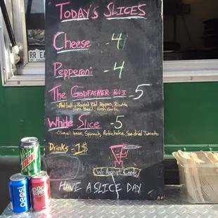 a chalkboard menu for a cheese shop