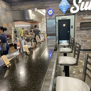 Bar stool area perfect for enjoying a cold brew on tap. sandwich and a soda