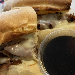 French Dip - Thinly sliced roasted beef, swiss cheese on a perfectly toasted fresh roll with hot aus jus.
