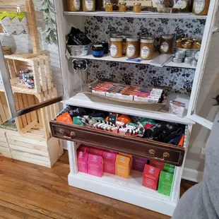 a pantry with a drawer full of goods