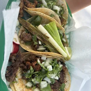 Top to bottom: pastor, carnitas, campechano tacos