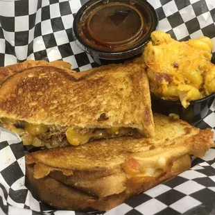 a grilled cheese sandwich with macaroni and cheese