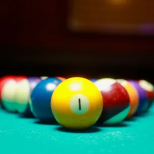 pool balls lined up on a pool table