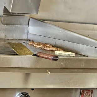 Hamburger and onion on the grill... sizzling!