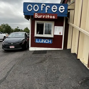 a car parked in front of a coffee burritos