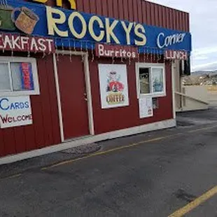 a car parked in front of a restaurant