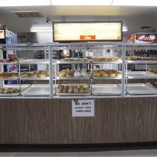 The donut case at 6 a.m.