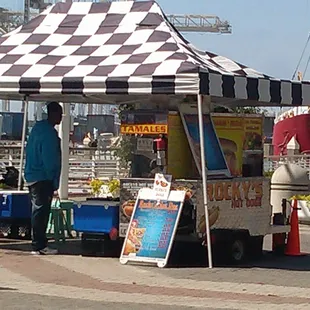 a man selling hot dogs