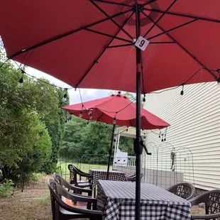 a table and chairs under an umbrella