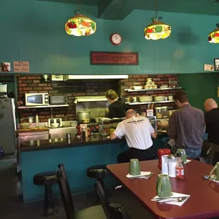 customers at the counter of a restaurant