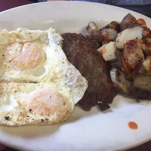Over easy eggs sausage home fries.