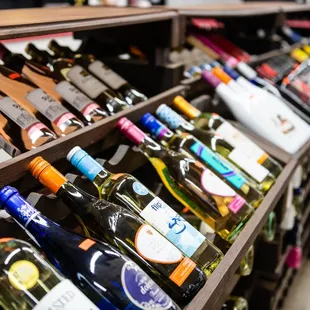 a shelf of wine bottles