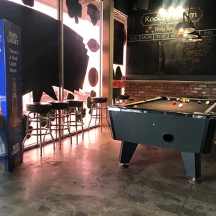 a pool table in the foreground