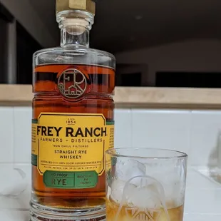 a bottle and a glass