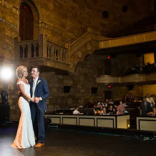a bride and groom sharing a first dance