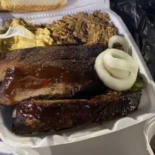 Cajun rice, potatoes salad and ribs