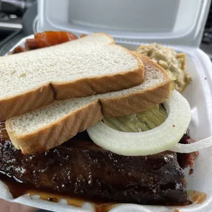 a sandwich in a styrofoam container