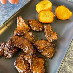 Anticuchos (beef heart with side of potatoes, choclo)