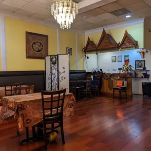 a dining room with tables and chairs