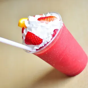 strawberries and whipped cream in a cup