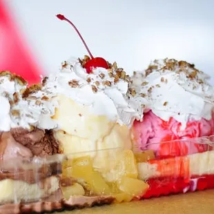 a banana split in a plastic container