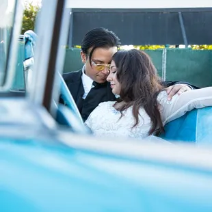 Bride and Groom in vintage car.
