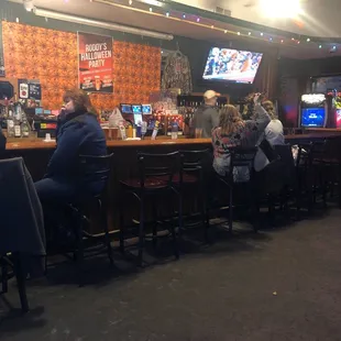 people sitting at the bar
