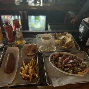 Rodeo Burger. Green chilli queso. Jalapeños ranch chicken salad. Fries. Corn dog.