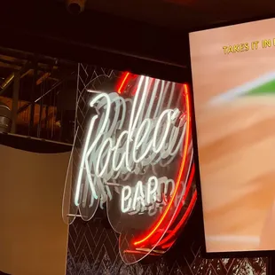 a neon sign for a bar